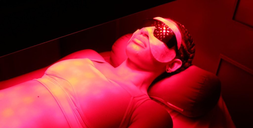 Patient in red light therapy session at PRANA